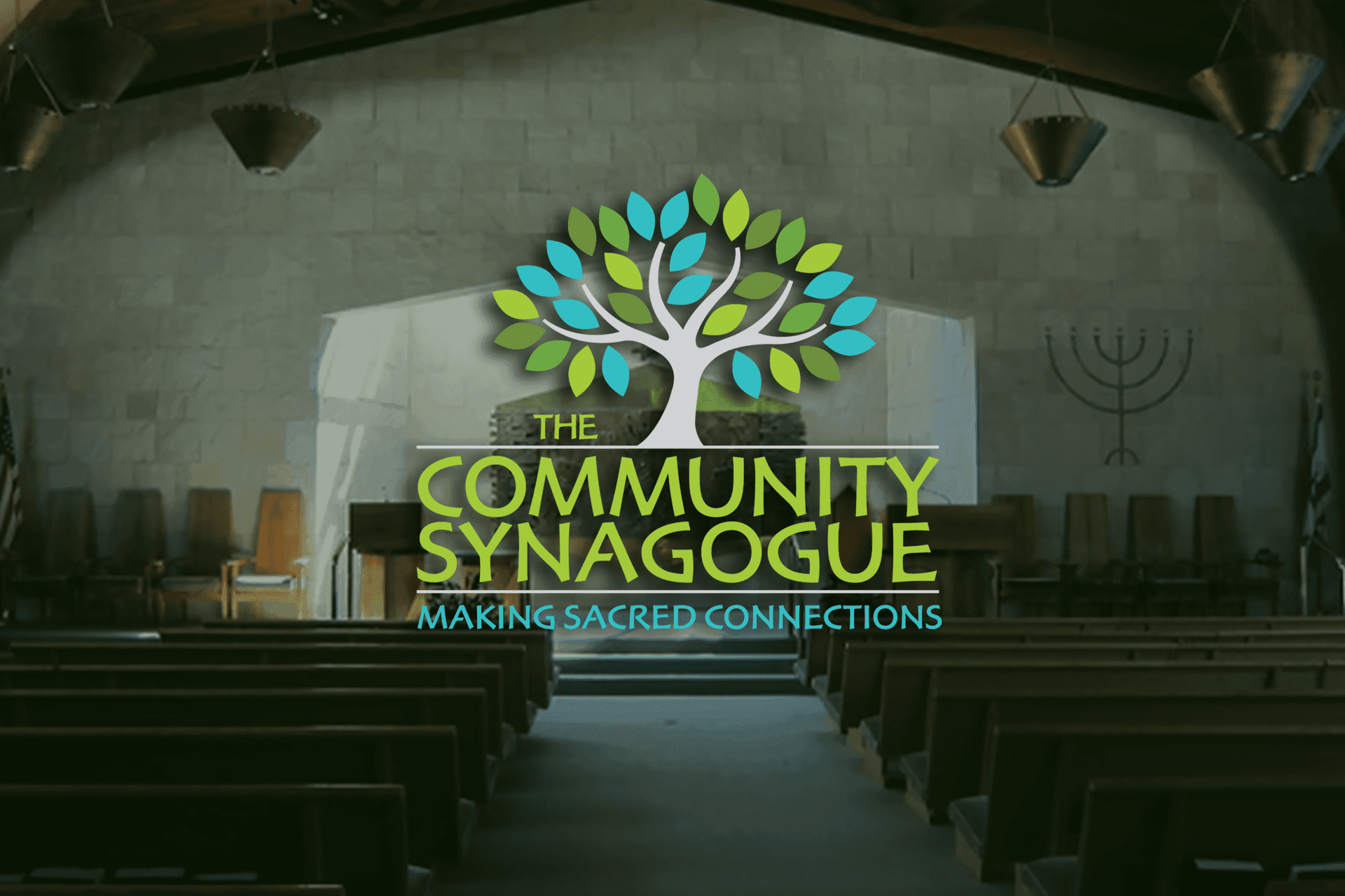 Interior of a synagogue with a logo overlay reading 'The Community Synagogue: Making Sacred Connections.'