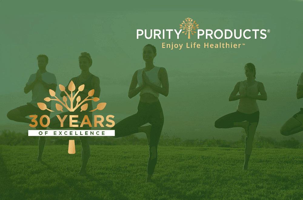 Purity Products 30 Years of Excellence logo with people practicing yoga outdoors on a green field.